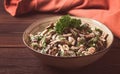 Chicken and mushroom salad, with herbs, seasoned with white sauce, close-up, rustic style,on a wooden table, toned, Royalty Free Stock Photo