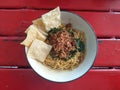 Chicken noodles on wooden table