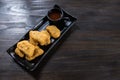 Chicken nugget in black dish