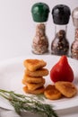 Chicken nuggets in a column on a plate with tomato Royalty Free Stock Photo