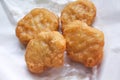 Chicken nuggets on white blotting paper oil Royalty Free Stock Photo