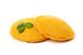 Chicken nuggets or yellow cutlets decorated with basil leaf, isolated on a white background