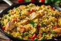 Chicken paella, Spanish traditional dish. Hearty meal with vegetables
