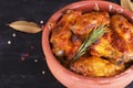 Chicken in paprika sauce baked in the oven in pottery. Chicken legs and wings Royalty Free Stock Photo