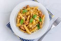 Chicken Penne Pasta Garnished with Fresh Basil Top Down Italian Food Photo