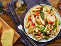 Chicken penne pasta with red bell peppers and asparagus