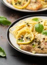 Chicken Piccata with capers, white wine sauce and spaghetti. Italian food Royalty Free Stock Photo