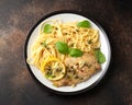 Chicken Piccata with capers, white wine sauce and spaghetti. Italian food Royalty Free Stock Photo