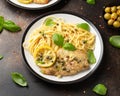 Chicken Piccata with capers, white wine sauce and spaghetti. Italian food Royalty Free Stock Photo