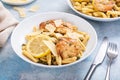 Chicken piccata pasta in a white bowl Royalty Free Stock Photo