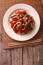 chicken pieces fried with vegetables and cashew nuts closeup. Vertical top view Royalty Free Stock Photo