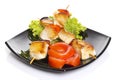 Chicken pieces grilled on skewers isolated