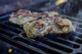 Chicken pieces marinated in spices are fried on the grill