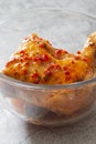 Chicken with a piri or peri marinade sauce in a glass bowl. Royalty Free Stock Photo