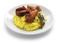 Chicken and pork adobo over yellow rice, filipino food Royalty Free Stock Photo