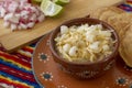 Chicken pozole with radishes, lemons and toast