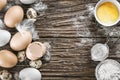 Chicken and quail eggs. Ingredients for cooking. Wooden table. T