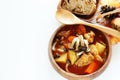 Chicken red soup and mushroom curry in white bowl