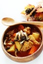 Chicken red soup and mushroom curry in white bowl