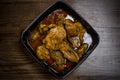 Chicken Rendang close up isolated on wooden background Royalty Free Stock Photo