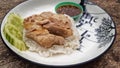 Chicken rice or Hainanese chicken rice on wood background Royalty Free Stock Photo