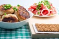 Chicken rissole, salad of fresh tomatoes and rye hardtack Royalty Free Stock Photo