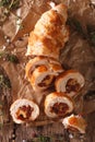 Chicken roll with cheese and sundried tomatoes close-up. vertical top view Royalty Free Stock Photo