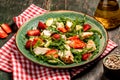 Chicken salad with arugula avocado and strawberries. Plate with a keto diet food. Top view Royalty Free Stock Photo