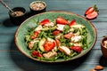 Chicken salad with arugula avocado and strawberries. Plate with a keto diet food. Top view Royalty Free Stock Photo