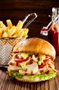 Chicken and salad burger with French fries