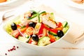 Chicken salad with cherry tomatoes, black olives, cucumber, red onion, red pepper, lettuce and fresh rosemary.