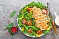 Chicken salad. Meat salad with fresh tomato, sweet pepper, arugula and grilled chicken breast. Chicken fillet with fresh vegetable Royalty Free Stock Photo