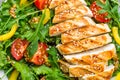 Chicken salad. Meat salad with fresh tomato, sweet pepper, arugula and grilled chicken breast. Chicken fillet with fresh vegetable Royalty Free Stock Photo