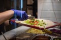 making a kebab in a restaurant chicken salad in rollo