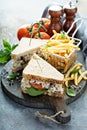 Chicken salad sandwich with spinach and tomato