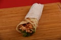 Chicken sandwich, Chapati crispy sandwich, Chicken roll wrap sandwich, on wooden board