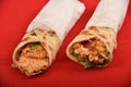 Chapati crispy sandwiches, two Chicken roll wrap sandwiches, on red background