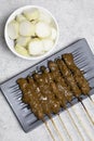 Chicken satay (sate ayam) with Lontong and peanut sauce