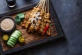 Chicken Satay or Sate Ayam - Malaysian famous food. Is a dish of seasoned, skewered and grilled meat, served with a Royalty Free Stock Photo