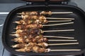 Grilled chicken skewers or sate or satay on a pan