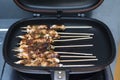 Grilled chicken skewers or sate or satay on a pan