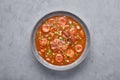 Chicken and Sausage Gumbo soup in gray bowl on concrete backdrop. Gumbo is louisiana cajun cuisine soup with roux. American USA Royalty Free Stock Photo