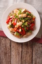 Chicken saute with mushrooms and vegetables close-up. vertical t