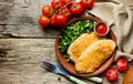Chicken schnitzel with cheese or cordon bleu with green salad an Royalty Free Stock Photo