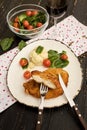 Chicken schnitzel served with mashed potatoes