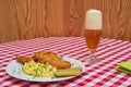 Chicken schnitzel served with sweet and sour pickled cucumbers and mashed potatoes Royalty Free Stock Photo