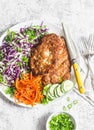 Chicken schnitzel tempura, red cabbage coleslaw and spicy pickled carrots on a light background, top view Royalty Free Stock Photo