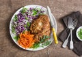 Chicken schnitzel tempura, red cabbage coleslaw and spicy pickled carrots on a wooden background, top view Royalty Free Stock Photo