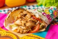 chicken shawarma readytoeat on a colorful paper wrap