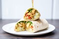 chicken shawarma wrap cut in half, showing the filling Royalty Free Stock Photo